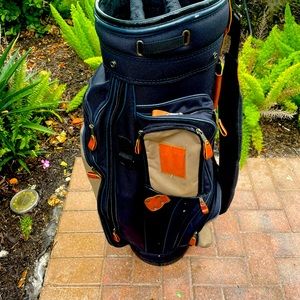 Wilson golf cart bag with shoulder strap , and club dividers .